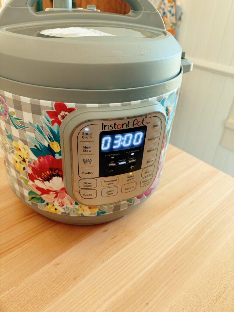 Showing that the soup/broth button has been pressed on the instant pot and set to 3 hours.
