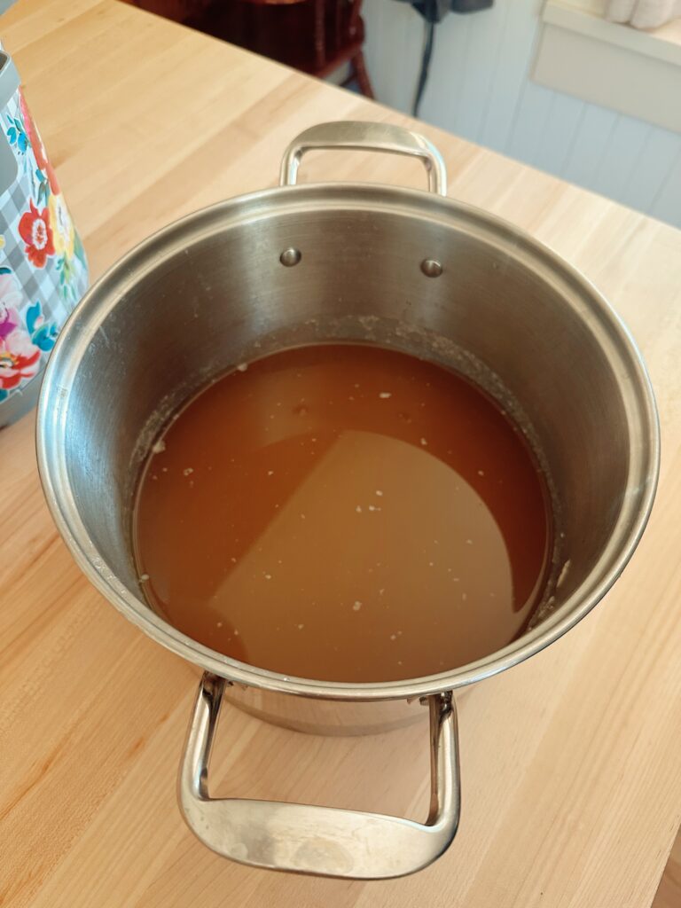 All of the coagulated fat has now been removed from the cooled liquid broth.